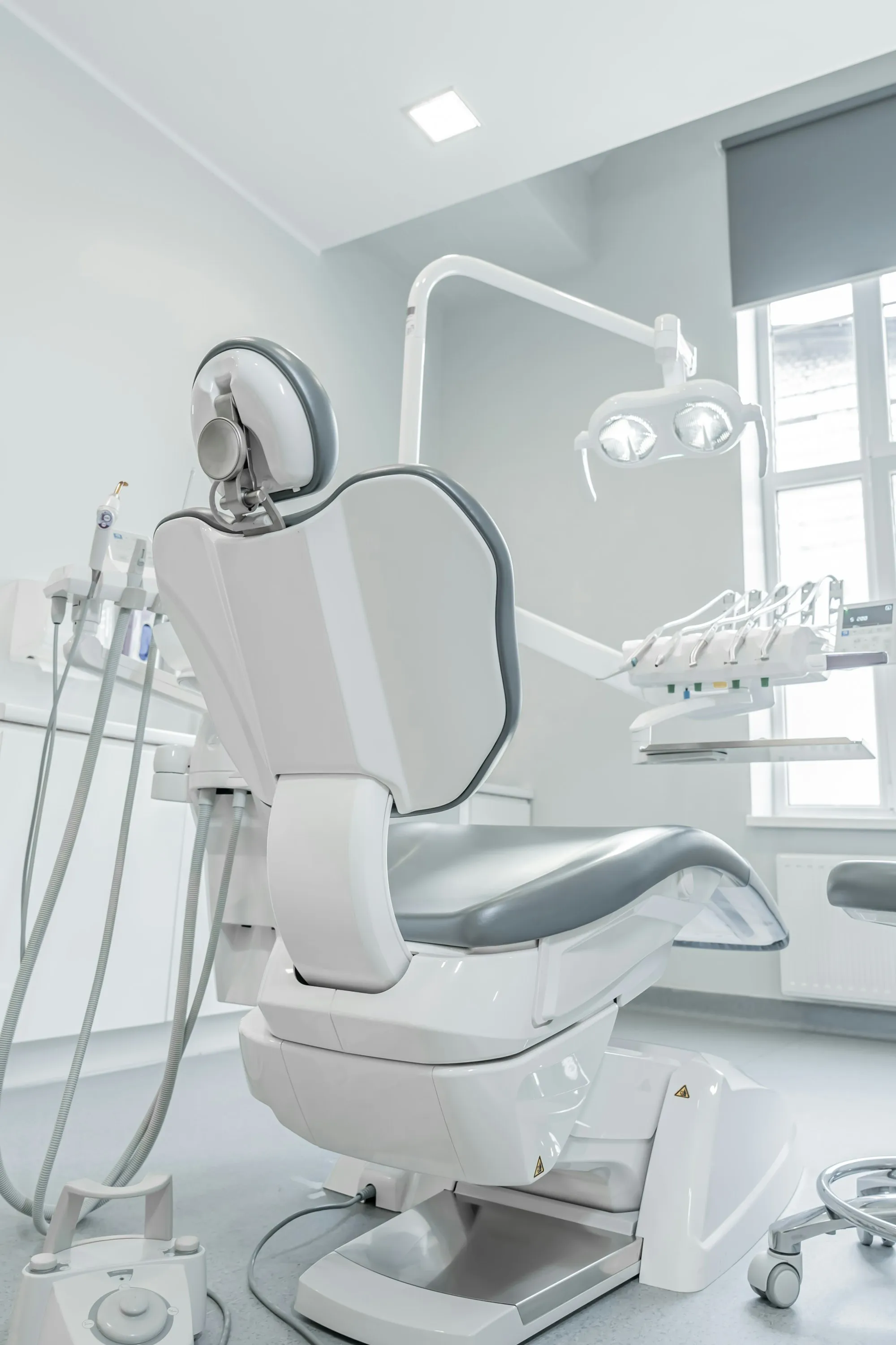 A quiet dental surgery, chair and window, before the first patient of the day.